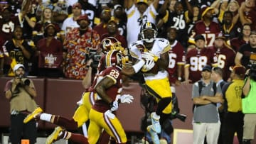 Sep 12, 2016; Landover, MD, USA; Pittsburgh Steelers wide receiver Antonio Brown (84) catches a touchdown as Washington Redskins strong safety DeAngelo Hall (23) and cornerback Bashaud Breeland (26) defend during the first half at FedEx Field. Mandatory Credit: Brad Mills-USA TODAY Sports