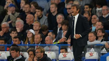 Liverpool's German manager Jurgen Klopp (L) and Chelsea's Italian head coach Antonio Conte watch thier players during the English Premier League football match between Chelsea and Liverpool at Stamford Bridge in London on September 16, 2016. / AFP / GLYN KIRK / RESTRICTED TO EDITORIAL USE. No use with unauthorized audio, video, data, fixture lists, club/league logos or 'live' services. Online in-match use limited to 75 images, no video emulation. No use in betting, games or single club/league/player publications. / (Photo credit should read GLYN KIRK/AFP/Getty Images)