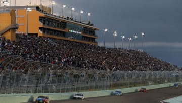 HOMESTEAD, FLORIDA - NOVEMBER 17: Kyle Busch, driver of the #18 M&M's Toyota, leads a pack of cars during the Monster Energy NASCAR Cup Series Ford EcoBoost 400 at Homestead Speedway on November 17, 2019 in Homestead, Florida. (Photo by Brian Lawdermilk/Getty Images)