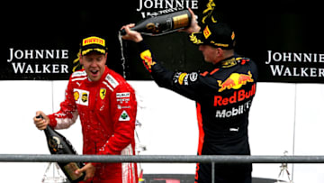 SPA, BELGIUM - AUGUST 26: Race winner Sebastian Vettel of Germany and Ferrari and third place finisher Max Verstappen of Netherlands and Red Bull Racing celebrate on the podium during the Formula One Grand Prix of Belgium at Circuit de Spa-Francorchamps on August 26, 2018 in Spa, Belgium. (Photo by Charles Coates/Getty Images)