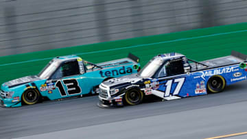 SPARTA, KENTUCKY - JULY 11: Johnny Sauter, driver of the #13 Tenda Heal Ford, races, Tyler Ankrum during the NASCAR Gander Outdoor Truck Series Buckle Up In Your Truck 225 at Kentucky Speedway on July 11, 2019 in Sparta, Kentucky. (Photo by Brian Lawdermilk/Getty Images)