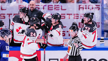 TAMPERE, FINLAND - MAY 29: Dylan Cozens of Canada (L) celebrates his goal with Nick Holden of Canada (M) during the 2022 IIHF Ice Hockey World Championship match between Finland and Canada at Nokia Arena on May 29, 2022 in Tampere, Finland. (Photo by Jari Pestelacci/Eurasia Sport Images/Getty Images)