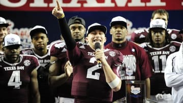 Dec 31, 2013; Atlanta, GA, USA; Texas A&M Aggies quarterback Johnny Manziel (2) speaks to fans after the game against Duke Blue Devils in the 2013 Chick-fil-A Bowl at the Georgia Dome. The Aggies won 52-48. Mandatory Credit: Kevin Liles-USA TODAY Sports