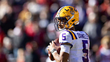 FAYETTEVILLE, ARKANSAS - NOVEMBER 12: Jayden Daniels #5 of the LSU Tigers drops back to pass during a game against the Arkansas Razorbacks at Donald W. Reynolds Razorback Stadium on November 12, 2022 in Fayetteville, Arkansas. The Tigers defeated the Razorbacks 13-10. (Photo by Wesley Hitt/Getty Images)