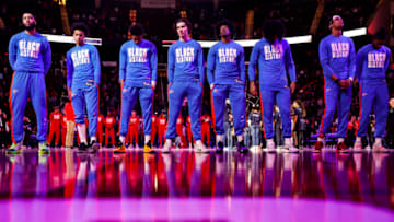 The Oklahoma City Thunder stand during the National Anthem (Photo by Carmen Mandato/Getty Images)