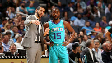 CHARLOTTE, NC - November 1: head coach James Borrego and Kemba Walker #15 of the Charlotte Hornets talk during a game against the Oklahoma City Thunder on November 1, 2018 at Spectrum Center in Charlotte, North Carolina. NOTE TO USER: User expressly acknowledges and agrees that, by downloading and/or using this Photograph, user is consenting to the terms and conditions of the Getty Images License Agreement. Mandatory Copyright Notice: Copyright 2018 NBAE (Photo by Kent Smith/NBAE via Getty Images)