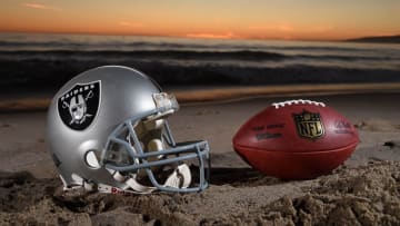 Feb 16, 2016; Los Angeles, CA, USA; General view of Oakland Raiders helmet and NFL Wilson Duke football at Santa Monica State Beach. NFL owners voted 30-2 to allow owner Rams Stan Kroenke (not pictured) to move the St. Louis Rams to Los Angeles for the 2016 season with an option also award to Raiders owner Mark Davis (not pictured). Mandatory Credit: Kirby Lee-USA TODAY Sports