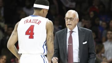Nov 14, 2014; Dallas, TX, USA; Southern Methodist Mustangs head coach Larry Brown talks with guard Keith Frazier (4) in the first half against the Lamar Cardinals at Moody Coliseum. Mandatory Credit: Tim Heitman-USA TODAY Sports