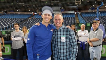 Houston Astros Hall of Famer with his son Cavan (Photo by Tom Szczerbowski/Getty Images)