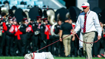 UGA's handler walks the iconic K9 across the field during the opening festivities of the Florida Georgia game Saturday. The Florida Gators lost to the Georgia Bulldogs 34-7 Saturday afternoon, October 30, 2021 at TIAA Bank Field in Jacksonville, FL. [Doug Engle/Gainesville Sun]2021Flgai 103021 Bulldogsvsgators
