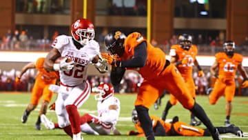 Nov 28, 2015; Stillwater, OK, USA; Oklahoma Sooners running back Samaje Perine (left) runs into the end zone for a touchdown against the Oklahoma State Cowboys in the second quarter at Boone Pickens Stadium. Mandatory Credit: Mark J. Rebilas-USA TODAY Sports