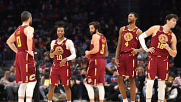 CLEVELAND, OHIO - DECEMBER 08: Kevin Love #0 Darius Garland #10 Ricky Rubio #3 Evan Mobley #4 and Cedi Osman #16 of the Cleveland Cavaliers joke during a timeout during the third quarter against the Chicago Bulls at Rocket Mortgage Fieldhouse on December 08, 2021 in Cleveland, Ohio. The Cavaliers defeated the Bulls 115-92. NOTE TO USER: User expressly acknowledges and agrees that, by downloading and/or using this photograph, user is consenting to the terms and conditions of the Getty Images License Agreement. (Photo by Jason Miller/Getty Images)