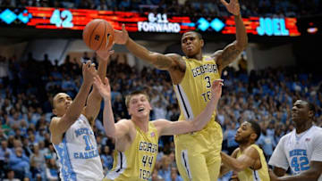 CHAPEL HILL, NC - JANUARY 02: Brice Johnson #11 of the North Carolina Tar Heels battles Ben Lammers #44 and Marcus Georges-Hunt #3 of the Georgia Tech Yellow Jackets for a rebound during their game at the Dean Smith Center on January 2, 2016 in Chapel Hill, North Carolina. North Carolina won 86-78. (Photo by Grant Halverson/Getty Images)