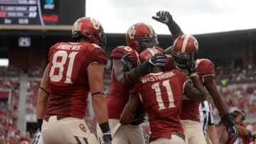 Oct 15, 2016; Norman, OK, USA; The Oklahoma Sooners celebrate after a touchdown against the Kansas State Wildcats during the third quarter at Gaylord Family - Oklahoma Memorial Stadium. Mandatory Credit: Mark D. Smith-USA TODAY Sports