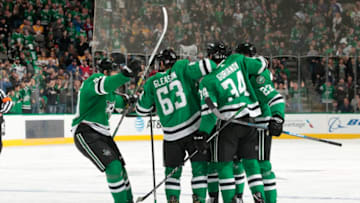 DALLAS, TX - NOVEMBER 10: Jason Spezza #90, Ben Gleason #63, Denis Gurianov #34 and the Dallas Stars celebrate a goal against the Nashville Predators at the American Airlines Center on November 10, 2018 in Dallas, Texas. (Photo by Glenn James/NHLI via Getty Images)