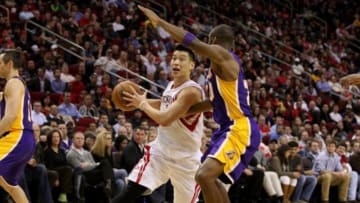 Jan 8, 2013; Houston, TX, USA; Houston Rockets point guard Jeremy Lin (left) drives to the basket during the third quarter against the Los Angeles Lakers at Toyota Center. Mandatory Credit: Troy Taormina-USA TODAY Sports
