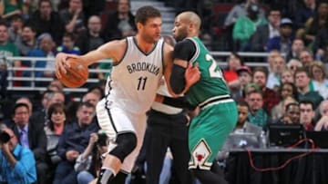 Mar 17, 2016; Chicago, IL, USA; Brooklyn Nets center Brook Lopez (11) is defended by Chicago Bulls forward Taj Gibson (22) during the second half at the United Center. Chicago won 118-102. Mandatory Credit: Dennis Wierzbicki-USA TODAY Sports