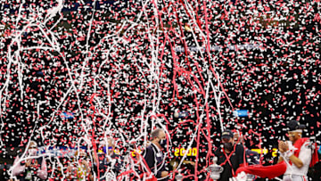 NEW ORLEANS, LOUISIANA - JANUARY 01: Confetti falls on head coach Ryan Day and Justin Fields #1 of the Ohio State Buckeyes after they defeated the Clemson Tigers 49-28 during the College Football Playoff semifinal game at the Allstate Sugar Bowl at Mercedes-Benz Superdome on January 01, 2021 in New Orleans, Louisiana. (Photo by Kevin C. Cox/Getty Images)