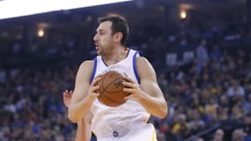 Jan 27, 2016; Oakland, CA, USA; Golden State Warriors center Andrew Bogut (12) holds onto a rebound against the Dallas Mavericks in the first quarter at Oracle Arena. Mandatory Credit: Cary Edmondson-USA TODAY Sports