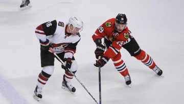Apr 5, 2016; Chicago, IL, USA; Chicago Blackhawks center Jonathan Toews (19) against Arizona Coyotes center Max Domi (16) during the game at the United Center. Mandatory Credit: Matt Marton-USA TODAY Sports
