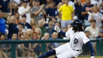 Aug 2, 2016; Detroit, MI, USA; Detroit Tigers center fielder Cameron Maybin (4) slides in safe at third after he hits an RBI triple in the fifth inning against the Chicago White Sox at Comerica Park. Mandatory Credit: Rick Osentoski-USA TODAY Sports