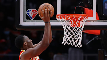 ATLANTA, GEORGIA - DECEMBER 22: Onyeka Okongwu #17 of the Atlanta Hawks dunks an alley-oop pass against the Orlando Magic during the second half at State Farm Arena on December 22, 2021 in Atlanta, Georgia. NOTE TO USER: User expressly acknowledges and agrees that, by downloading and or using this photograph, User is consenting to the terms and conditions of the Getty Images License Agreement. (Photo by Kevin C. Cox/Getty Images)