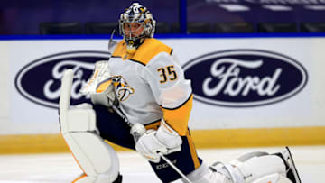 TAMPA, FLORIDA - JANUARY 30: Pekka Rinne #35 of the Nashville Predators warms up during a game against the Tampa Bay Lightning at Amalie Arena on January 30, 2021 in Tampa, Florida. (Photo by Mike Ehrmann/Getty Images)
