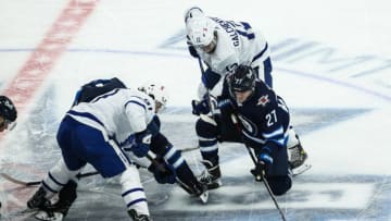 Winnipeg Jets forward Nikolaj Ehlers (27) and Toronto Maple Leafs forward John Taveres (91). (Terrence Lee-USA TODAY Sports)