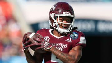 Jan 2, 2023; Tampa, FL, USA; Mississippi State Bulldogs wide receiver Lideatrick Griffin (5) runs with the ball against the Illinois Fighting Illini in the first quarter during the 2023 ReliaQuest Bowl at Raymond James Stadium. Mandatory Credit: Nathan Ray Seebeck-USA TODAY Sports