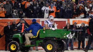 Nov 29, 2015; Denver, CO, USA; New England Patriots tight end Rob Gronkowski (87) is carted off the field in the fourth quarter against the Denver Broncos at Sports Authority Field at Mile High. The Broncos defeated the Patriots 30-24 in overtime. Mandatory Credit: Ron Chenoy-USA TODAY Sports