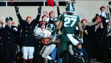 Nov 8, 2014; East Lansing, MI, USA; Ohio State Buckeyes running back Dontre Wilson (2) makes a catch in the end zone for a touchdown during the third quarter against the Michigan State Spartans at Spartan Stadium. Mandatory Credit: Andrew Weber-USA TODAY Sports
