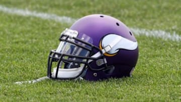 Jul 26, 2013; Mankato, MN, USA; Minnesota Vikings helmet sits in the grass during training camp at Minnesota State University. Mandatory Credit: Brace Hemmelgarn-USA TODAY Sports