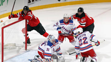 Igor Shesterkin #31, Ryan Lindgren #55 and Anthony Bitetto #22 of the New York Rangers. (Photo by Bruce Bennett/Getty Images)