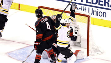 TORONTO, ONTARIO - AUGUST 17: Par Lindholm #26 of the Boston Bruins celebrates a goal by his teammate Connor Clifton (not pictured) against the Carolina Hurricanes during the third period in Game Four of the Eastern Conference First Round during the 2020 NHL Stanley Cup Playoffs at Scotiabank Arena on August 17, 2020 in Toronto, Ontario. (Photo by Elsa/Getty Images)