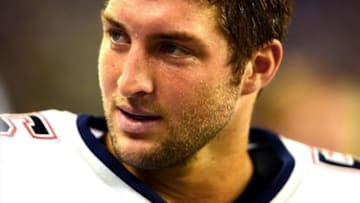 Aug 22, 2013; Detroit, MI, USA; New England Patriots quarterback Tim Tebow (5) on the sidelines in the second quarter of a preseason game against the Detroit Lions at Ford Field. Mandatory Credit: Andrew Weber-USA TODAY Sports