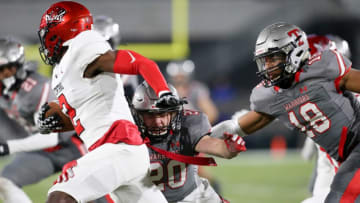Auburn footballThompson linebacker Kendall Franklin LB (20) and Thompson linebacker Seth Hampton (18) work to tackle Central wide receiver Karmello English (2) during the 7A state championship game in Birmingham Wednesday, Dec. 1, 2021. [Staff Photo/Gary Cosby Jr]7a Championship Central Vs Thompson