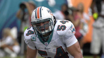 MIAMI, FL - OCTOBER 21: Linebacker Zach Thomas #54 of the Miami Dolphins lines up against the New England Patriots at Dolphin Stadium on October 21, 2007 in Miami, Florida. The Pats won 49 - 28. (Photo by Al Messerschmidt/Getty Images)