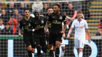 SWANSEA, WALES - SEPTEMBER 10: Jamaal Lascelles of Newcastle United celebrates after he scores his side's first goal during the Premier League match between Swansea City and Newcastle United at Liberty Stadium on September 10, 2017 in Swansea, Wales. (Photo by Stu Forster/Getty Images)
