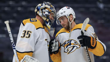 Nashville Predators goaltender Pekka Rinne (35) celebrates with center Calle Jarnkrok (19) after defeating the Columbus Blue Jackets at Nationwide Arena. Mandatory Credit: Aaron Doster-USA TODAY Sports