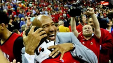Apr 15, 2015; New Orleans, LA, USA; New Orleans Pelicans head coach Monty Williams celebrates with guard Eric Gordon (10) following a win against the San Antonio Spurs at the Smoothie King Center. The Pelicans defeated the Spurs 108-103 to earn the 8th seed in the Western Conference Playoffs. Mandatory Credit: Derick E. Hingle-USA TODAY Sports
