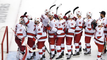 TORONTO, ONTARIO - AUGUST 04: James Reimer #47 of the Carolina Hurricanes celebrates with his teammates after defeating the New York Rangers in Game Three of the Eastern Conference Qualification Round prior to the 2020 NHL Stanley Cup Playoffs at Scotiabank Arena on August 04, 2020 in Toronto, Ontario, Canada. (Photo by Andre Ringuette/Freestyle Photo/Getty Images)