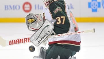 Apr 30, 2013; Chicago, IL, USA; Minnesota Wild goalie Josh Harding (37) makes a save against the Chicago Blackhawks during the first period in game one of the first round of the 2013 Stanley Cup playoffs at the United Center. Mandatory Credit: Rob Grabowski-USA TODAY Sports