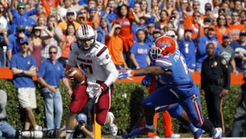 Nov 15, 2014; Gainesville, FL, USA; Florida Gators defensive lineman Dante Fowler Jr. (6) and defensive lineman Darious Cummings (55) pressures South Carolina Gamecocks quarterback Dylan Thompson (17) during the second quarter at Ben Hill Griffin Stadium. Mandatory Credit: Kim Klement-USA TODAY Sports