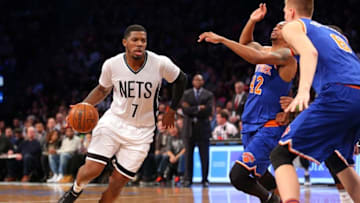 Feb 19, 2016; Brooklyn, NY, USA; Brooklyn Nets small forward Joe Johnson (7) drives against New York Knicks small forward Lance Thomas (42) and power forward Kristaps Porzingis (6) during the third quarter at Barclays Center. The Nets defeated the Knicks 109-98. Mandatory Credit: Brad Penner-USA TODAY Sports
