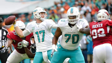 Dec 11, 2016; Miami Gardens, FL, USA; Miami Dolphins quarterback Ryan Tannehill (17) throws a touchdown pass during the first half against the Arizona Cardinals at Hard Rock Stadium. Mandatory Credit: Steve Mitchell-USA TODAY Sports