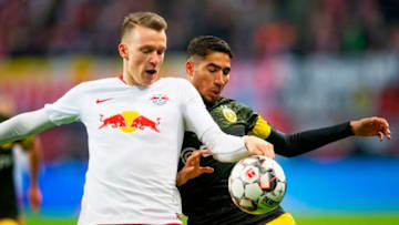 Leipzig's defender Lukas Klostermann (L) vies with Dortmund's Moroccan defender Achraf Hakimi during the German first division Bundesliga football match RB Leipzig v Borussia Dortmund in Leipzig, eastern Germany, on January 19, 2019. (Photo by ROBERT MICHAEL / AFP) / DFL REGULATIONS PROHIBIT ANY USE OF PHOTOGRAPHS AS IMAGE SEQUENCES AND/OR QUASI-VIDEO (Photo credit should read ROBERT MICHAEL/AFP/Getty Images)