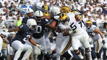 Nov 21, 2015; University Park, PA, USA; Michigan Wolverines safety Jabrill Peppers (5) runs with the ball during the third quarter against the Penn State Nittany Lions at Beaver Stadium. Michigan defeated Penn State 28-16. Mandatory Credit: Matthew O