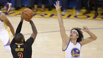 June 19, 2016; Oakland, CA, USA; Cleveland Cavaliers guard Kyrie Irving (2) shoots against Golden State Warriors forward Anderson Varejao (18) in the first half in game seven of the NBA Finals at Oracle Arena. Mandatory Credit: Kelley L Cox-USA TODAY Sports
