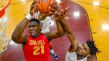 MIDDLE VILLAGE, NEW YORK - APRIL 05: Gerald Drumgoole #4 of La Lumiere battles for the ball with Kofi Cockburn #21 of Oak Hill Academy in the semifinal of the GEICO High School National Tournament at Christ the King High School on April 05, 2019 in Middle Village, New York. (Photo by Steven Ryan/Getty Images)