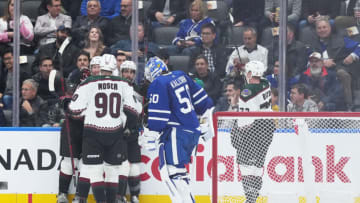 Oct 17, 2022; Toronto, Ontario, CAN; Arizona Coyotes defenseman Shayne Gostisbehere (14) celebrates scoring a goal with Arizona Coyotes defenseman J.J. Moser (90) against the Toronto Maple Leafs during the third period at the Scotiabank Arena. Mandatory Credit: Nick Turchiaro-USA TODAY Sports